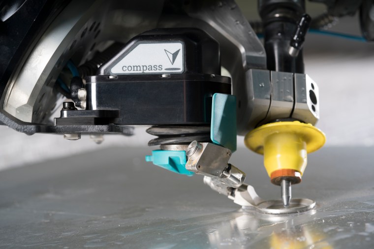 Compass cutting warped material at an angle